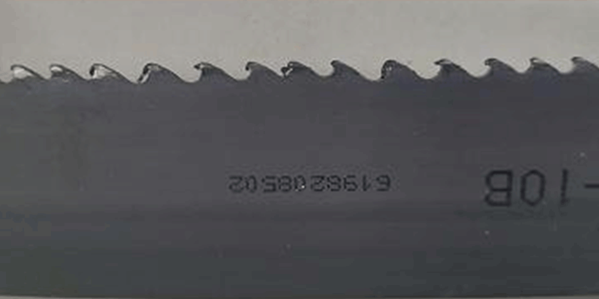 Chips welded to band saw blade teeth